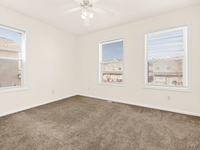4400 Rawhide Rd Unit 132, Pueblo, CO 81008 - spare room featuring carpet, visible vents, baseboards, and ceiling fan