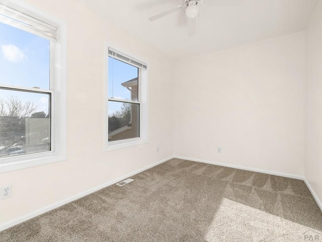 4400 Rawhide Rd Unit 132, Pueblo, CO 81008 - spare room featuring ceiling fan, carpet floors, visible vents, and baseboards