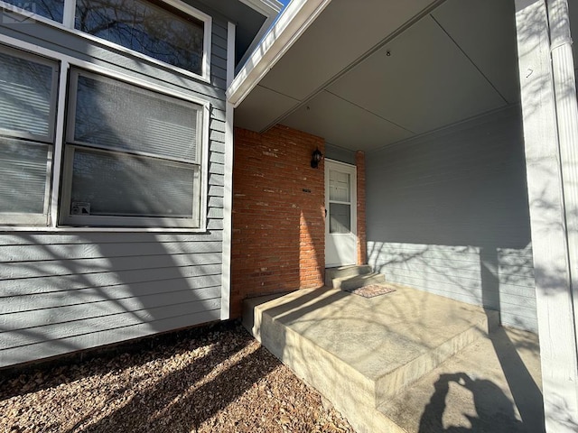 exterior space with brick siding