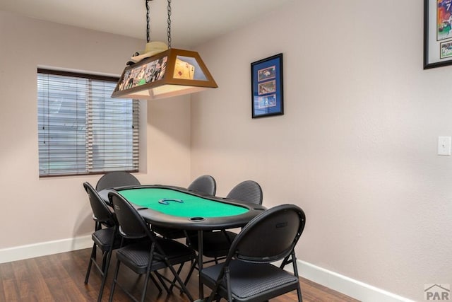 playroom featuring wood finished floors and baseboards