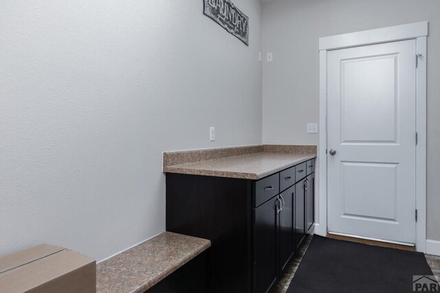 interior space with dark cabinetry