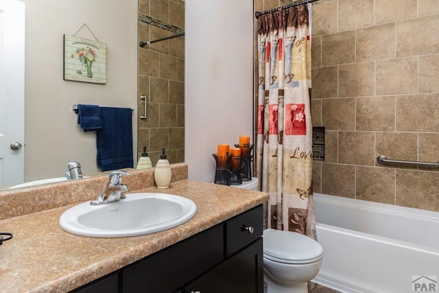 full bathroom featuring shower / bath combination with curtain, vanity, and toilet