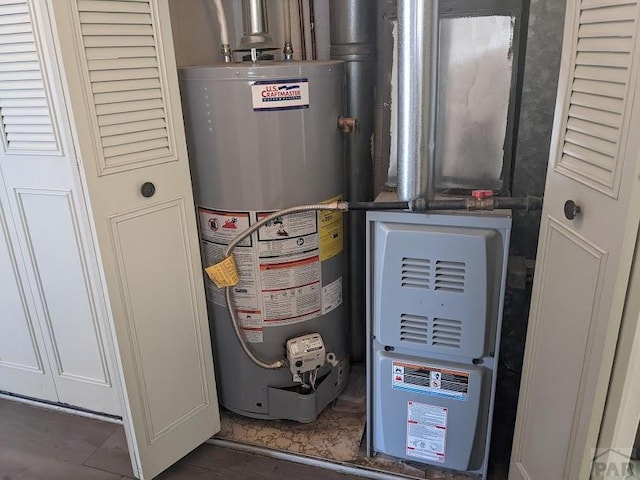 utility room featuring water heater