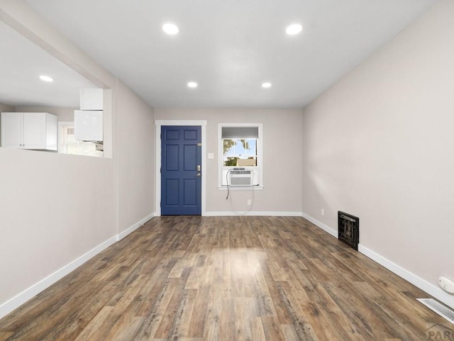 2619 7th Ave, Pueblo, CO 81003 - entryway with baseboards, wood finished floors, recessed lighting, and cooling unit