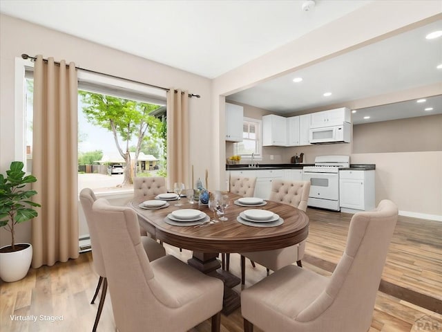 2619 7th Ave, Pueblo, CO 81003 - dining space with light wood-style flooring, recessed lighting, and baseboards
