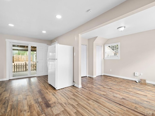 2619 7th Ave, Pueblo, CO 81003 - kitchen featuring freestanding refrigerator, baseboards, wood finished floors, and recessed lighting