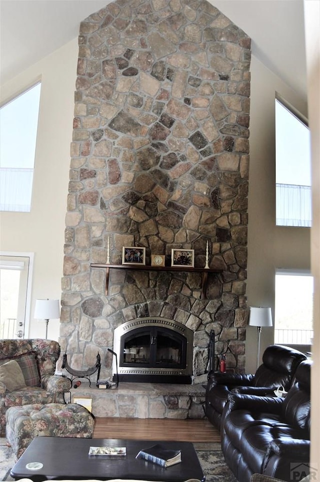 205 Hoofprint Ct, Walsenburg, CO 81089 - living room featuring a fireplace and high vaulted ceiling