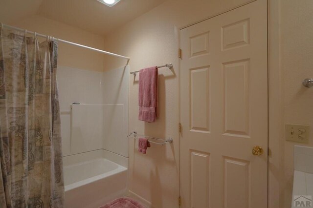 full bathroom with shower / tub combo with curtain