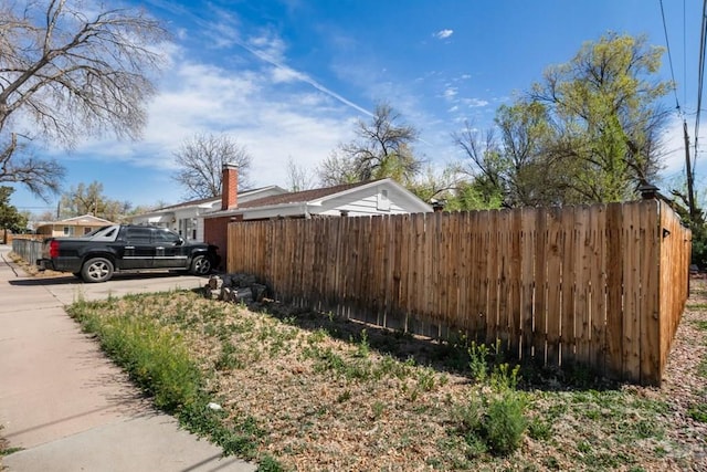 view of home's exterior with fence