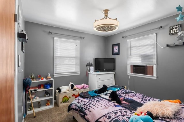 carpeted bedroom with cooling unit