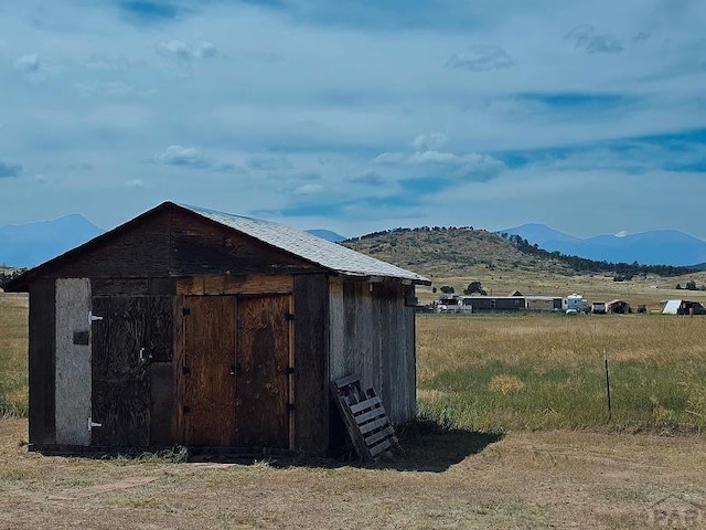 view of shed featuring a mountain view