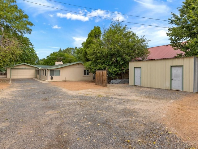417 Park Dr, Pueblo, CO 81005 - view of front of home featuring driveway and metal roof