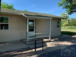 417 Park Dr, Pueblo, CO 81005 - view of property exterior with stucco siding and a patio
