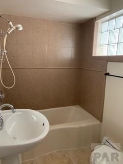 417 Park Dr, Pueblo, CO 81005 - full bathroom with a sink, tub / shower combination, toilet, and tile patterned flooring