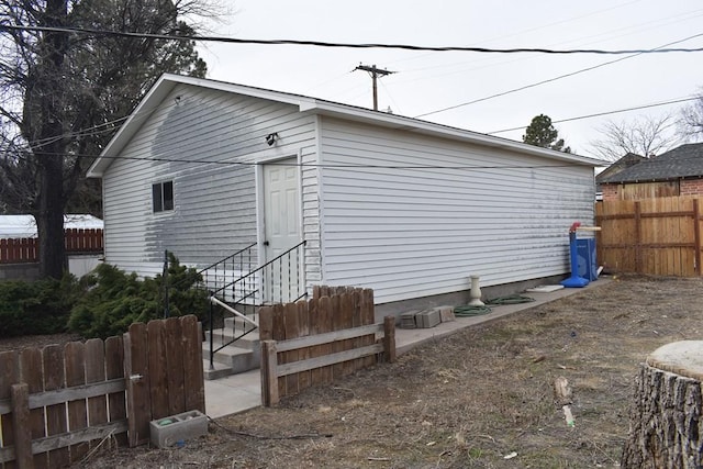 exterior space with entry steps and fence