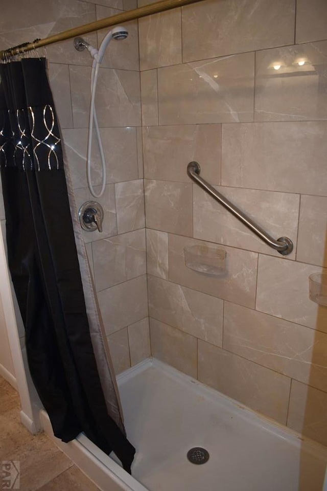 bathroom with a shower stall