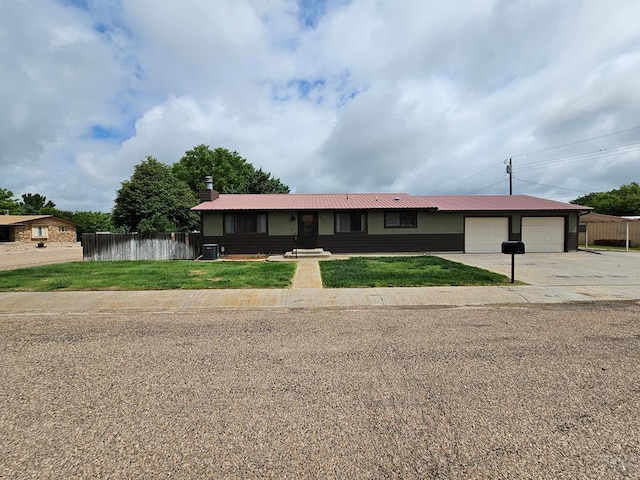 789 W 4th Ave, Springfield, CO 81073 - ranch-style home with a garage, driveway, a chimney, metal roof, and cooling unit