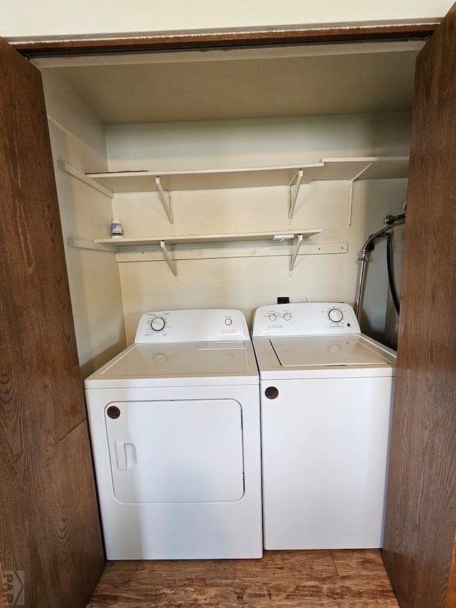 789 W 4th Ave, Springfield, CO 81073 - washroom with washer and clothes dryer and wood finished floors