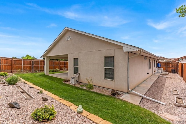 5048 Sage St, Pueblo, CO 81005 - back of property featuring stucco siding, a patio area, and ac unit
