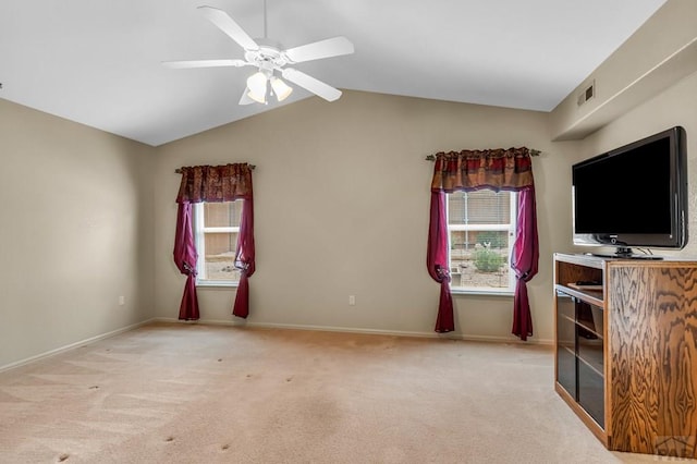 5048 Sage St, Pueblo, CO 81005 - unfurnished living room with light colored carpet, lofted ceiling, a ceiling fan, and baseboards
