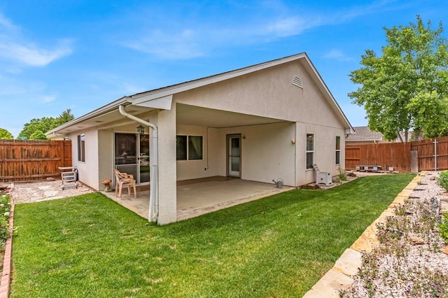 5048 Sage St, Pueblo, CO 81005 - rear view of property with stucco siding and a patio area