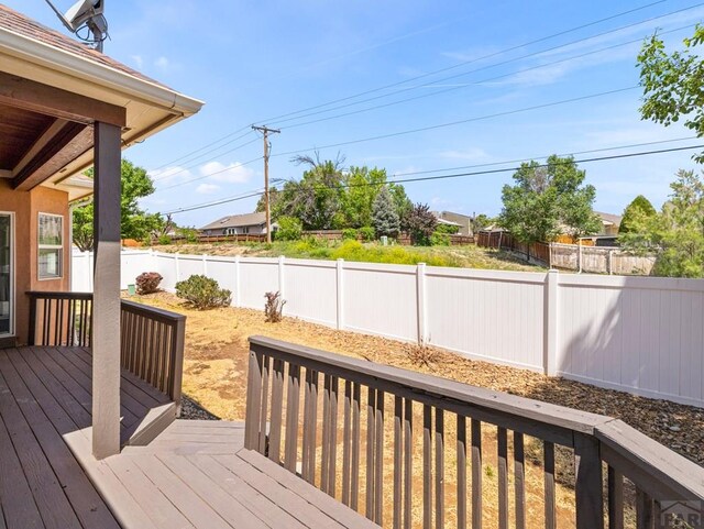 1705 Aquila Dr, Pueblo, CO 81008 - wooden deck featuring a fenced backyard