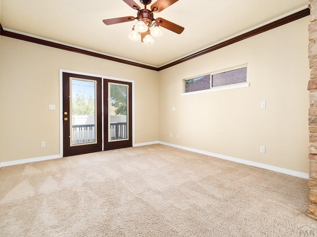 1705 Aquila Dr, Pueblo, CO 81008 - unfurnished room with carpet, crown molding, baseboards, and ceiling fan