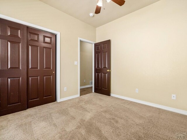1705 Aquila Dr, Pueblo, CO 81008 - unfurnished bedroom featuring carpet flooring, baseboards, and a ceiling fan