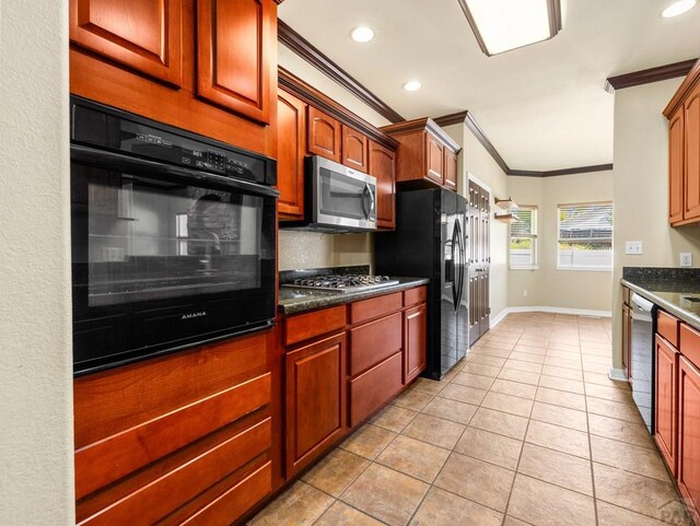 1705 Aquila Dr, Pueblo, CO 81008 - kitchen with black appliances, crown molding, dark countertops, light tile patterned floors, and baseboards