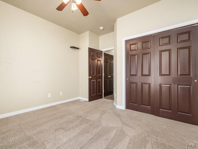 1705 Aquila Dr, Pueblo, CO 81008 - unfurnished bedroom with carpet flooring, baseboards, and ceiling fan