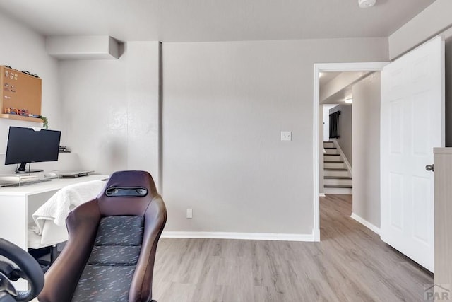 office space with wood finished floors and baseboards