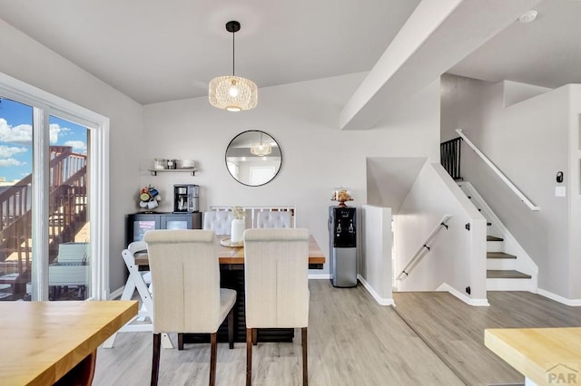 dining area featuring light wood-style flooring and baseboards