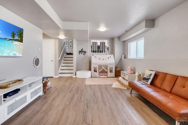 recreation room with wood finished floors