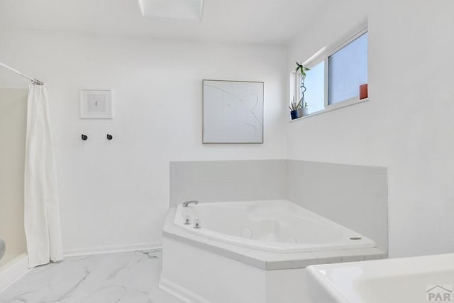 bathroom featuring marble finish floor, baseboards, curtained shower, and a bath