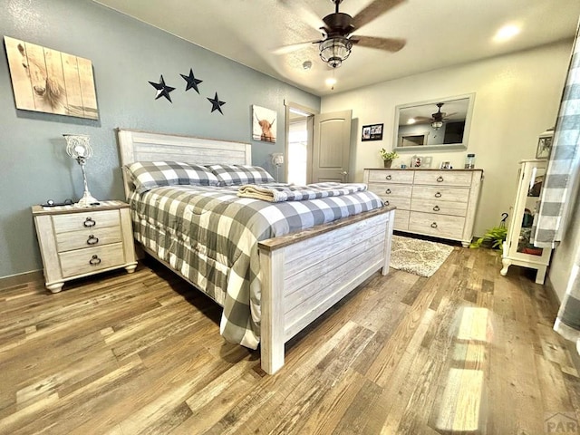 74 James Ave, Westcliffe, CO 81252 - bedroom with wood finished floors, baseboards, and a ceiling fan