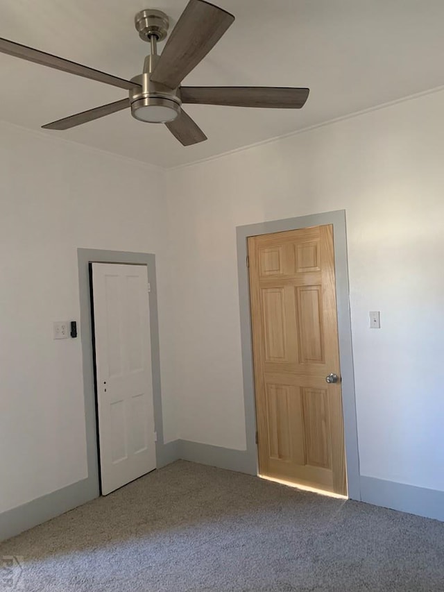309 Walsen Ave, Walsenburg, CO 81089 - unfurnished room with baseboards, a ceiling fan, and carpet flooring
