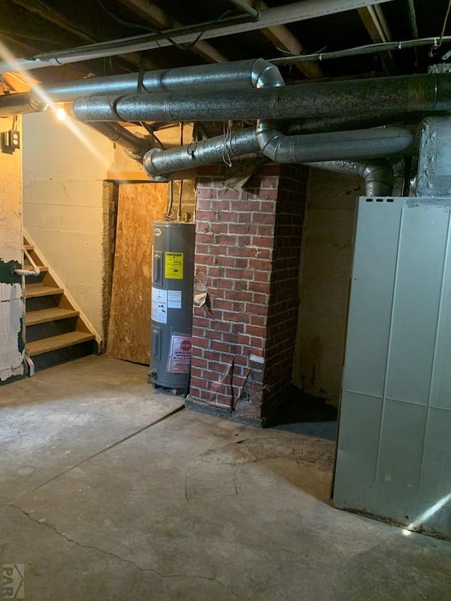 309 Walsen Ave, Walsenburg, CO 81089 - unfinished basement with water heater and stairway