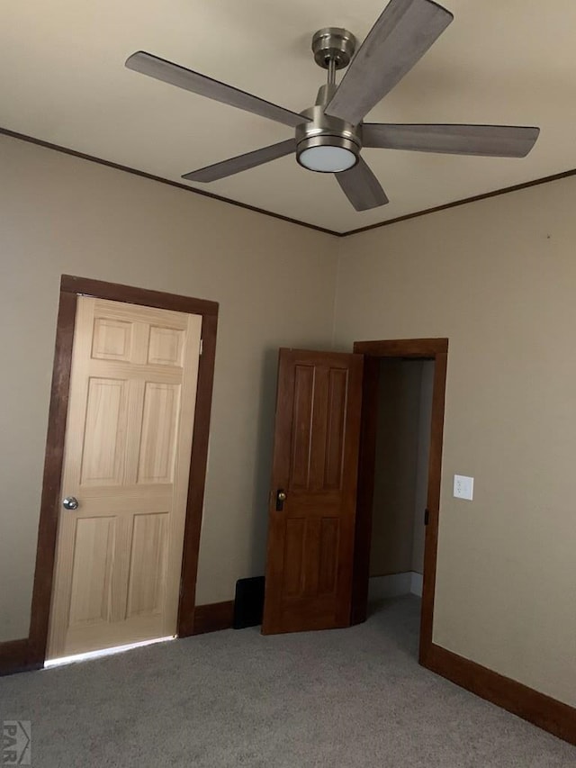 309 Walsen Ave, Walsenburg, CO 81089 - unfurnished bedroom featuring carpet, baseboards, and a ceiling fan
