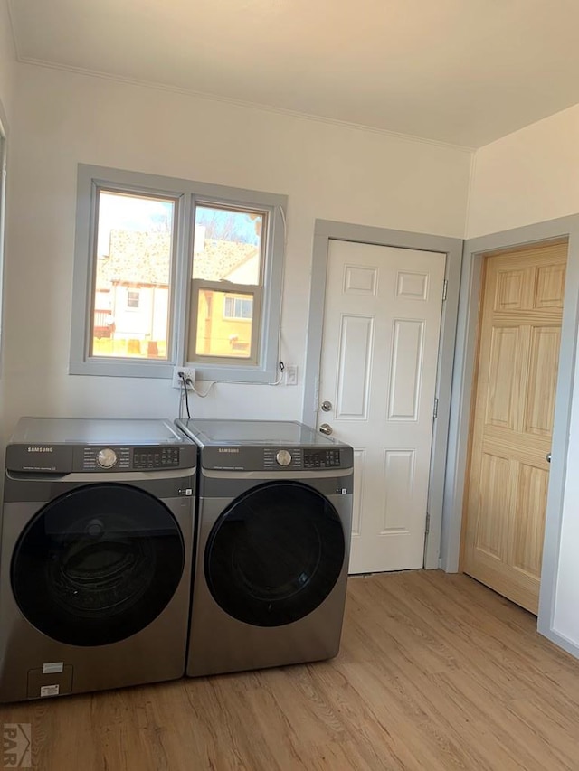 309 Walsen Ave, Walsenburg, CO 81089 - clothes washing area featuring laundry area, washer and clothes dryer, and light wood-type flooring