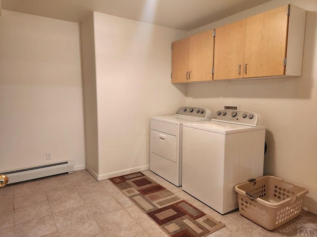 laundry room featuring baseboard heating, independent washer and dryer, cabinet space, and baseboards