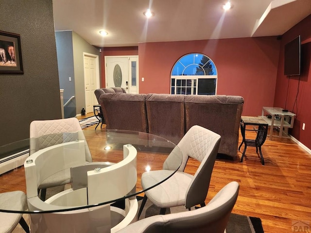 dining room featuring recessed lighting, baseboards, baseboard heating, and wood finished floors