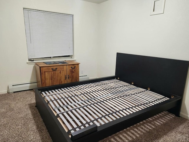 bedroom featuring a baseboard radiator, baseboards, baseboard heating, and carpet flooring