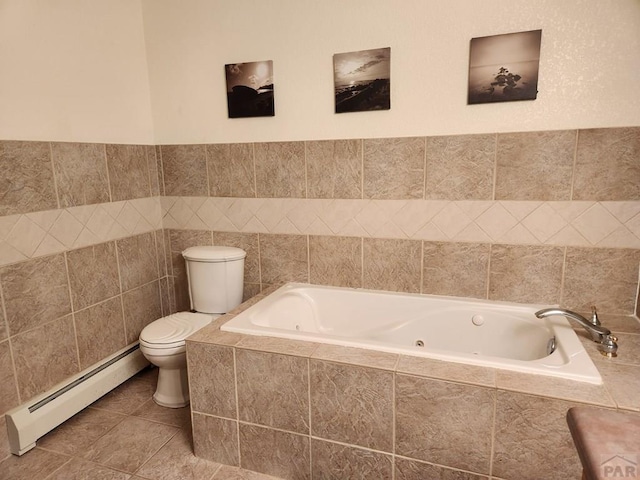 bathroom with toilet, tile walls, baseboard heating, tile patterned floors, and a tub with jets