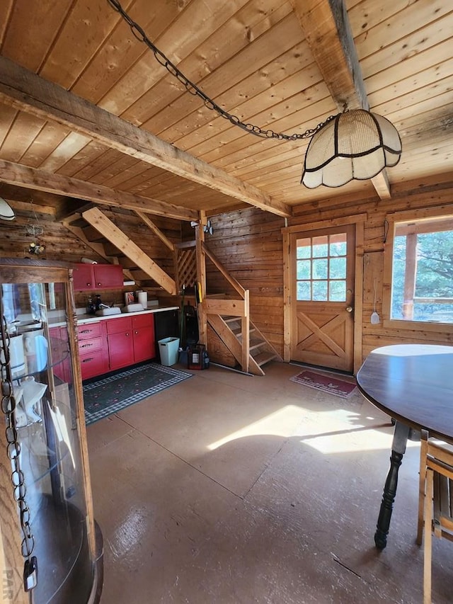 unfinished attic with an upstairs landing