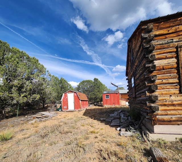 view of yard with a shed and an outdoor structure