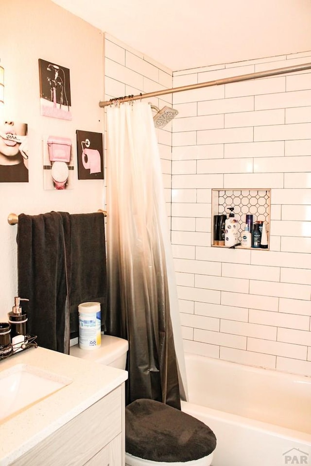 bathroom with toilet, shower / tub combo with curtain, and vanity