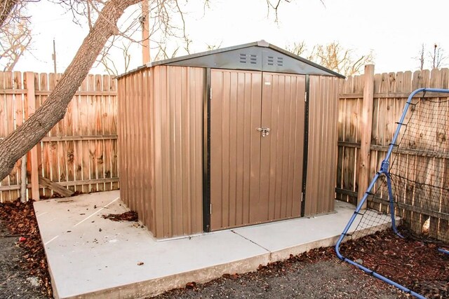 view of shed with a fenced backyard