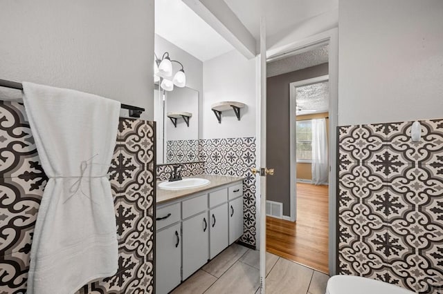 1516 Zuni Rd, Pueblo, CO 81001 - half bath featuring vanity and decorative backsplash