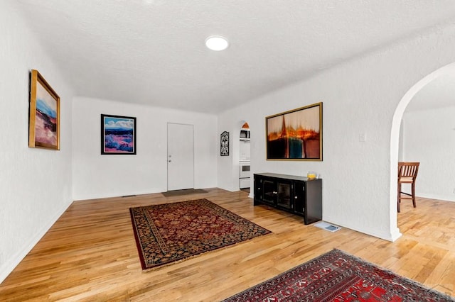 501 E Main St, Trinidad, CO 81082 - foyer with arched walkways, light wood finished floors, and baseboards