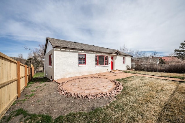 501 E Main St, Trinidad, CO 81082 - back of property featuring a fenced backyard and brick siding